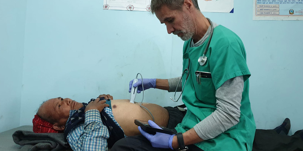 Dr. Jesus Casado performing an abdominal ultrasound scan on a patient in Nepal.