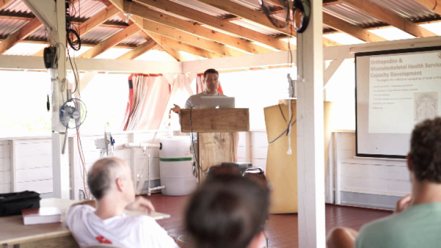 Dr. Ben LaBrot lectures about patient care at Floating Doctors headquarters in Panama.